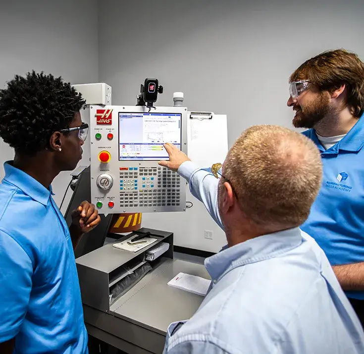Instructors explaining equipment to participant