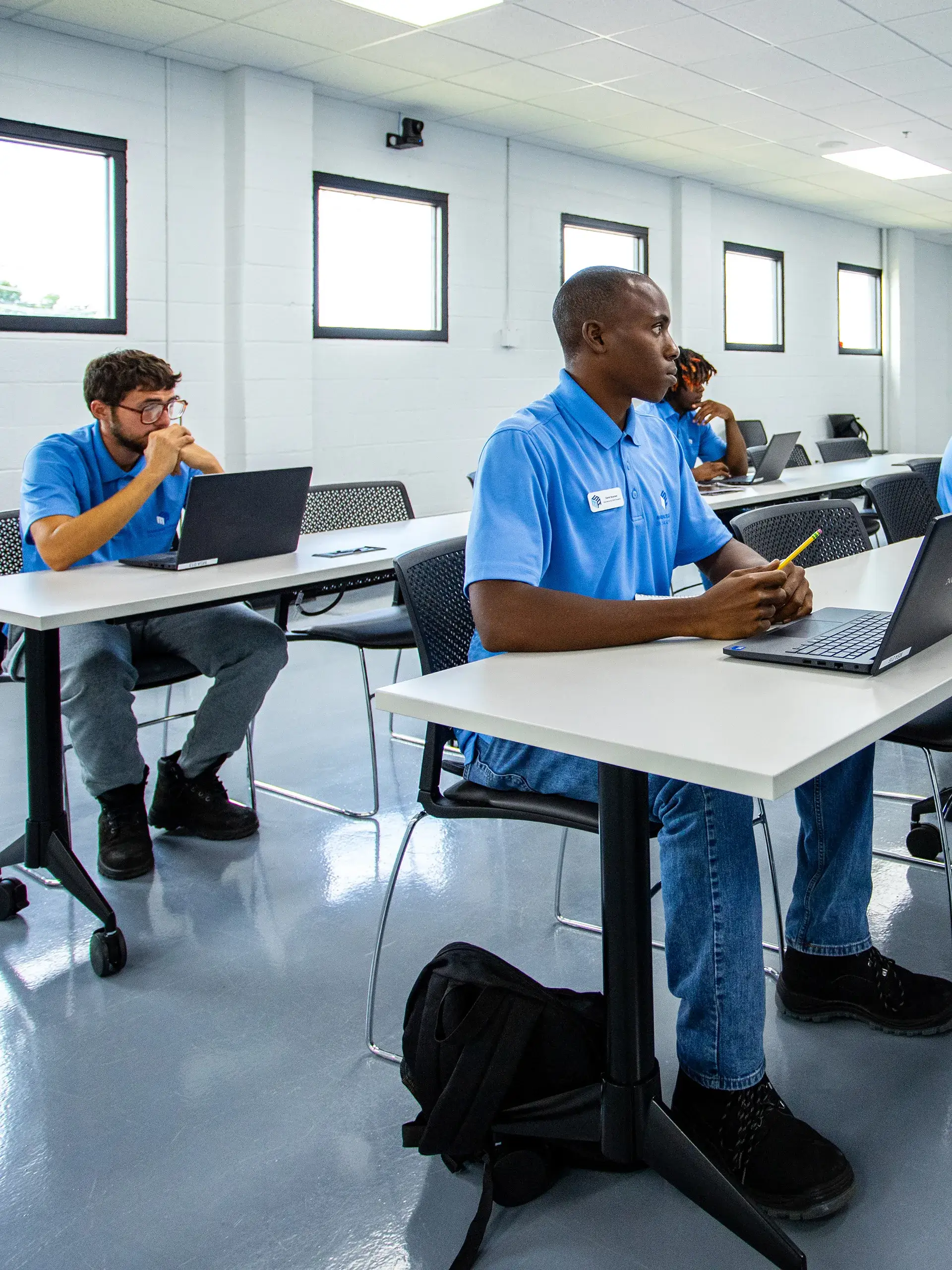 Group of participants listening to instructor