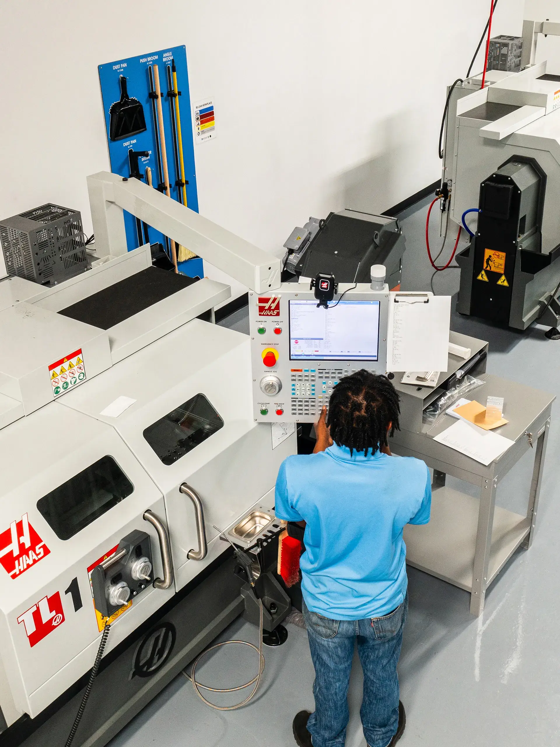 Participant utilizing CNC equipment