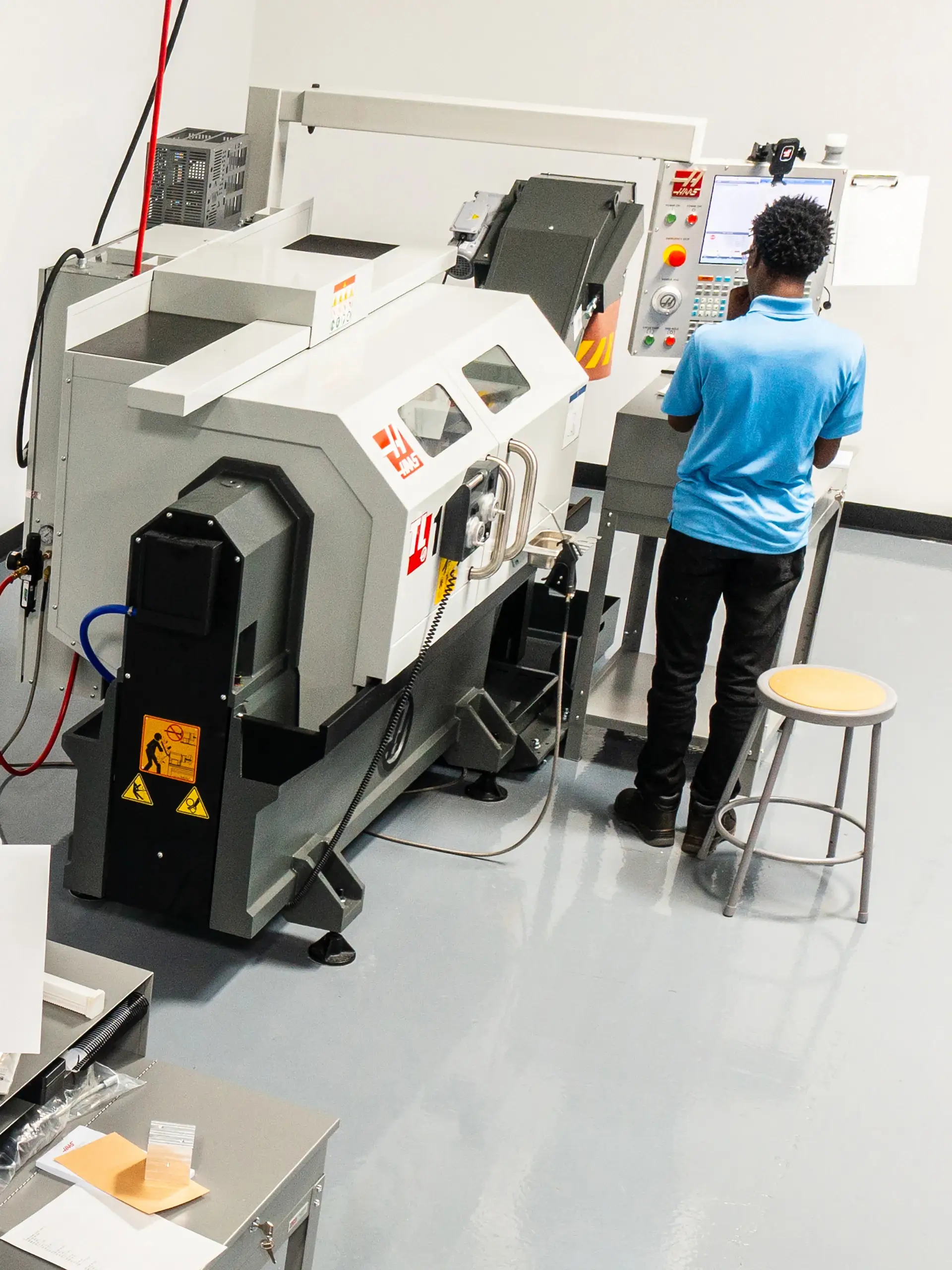 Participant utilizing CNC equipment